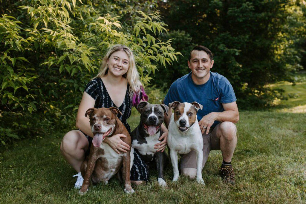 richard and alana with three dogs
