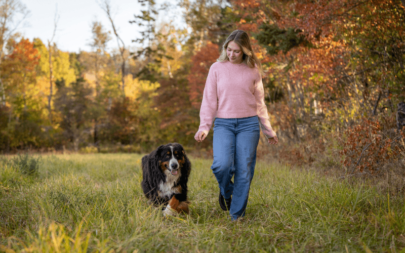 Woman Walking with Dog at Dog-Friendly Fall Getaway in Belgrade Lakes