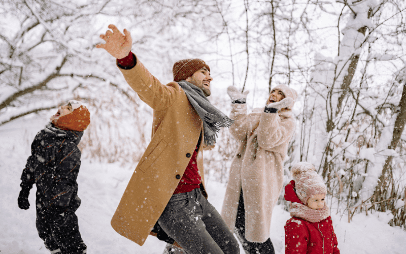 A Family Enjoying a Snow Fall